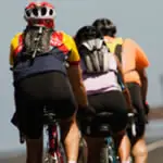 Wearing cycling shorts, as opposed to regular shorts over cotton underwear, will help cut down on friction that leads to saddle sores.