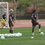 Player wait in line for 1-v-1 drills.
