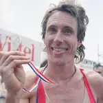 <strong>Mark Allen shows off his medal after winning the Nice Triathlon in 1991, a race he would win 10 times during his career.</strong><br><br>AP Photo/Gilbert Tourta